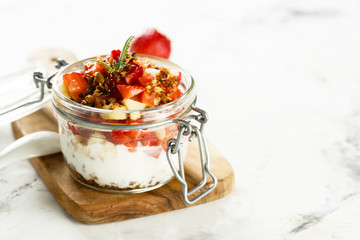 Homemade dessert with granola, banana and strawberry