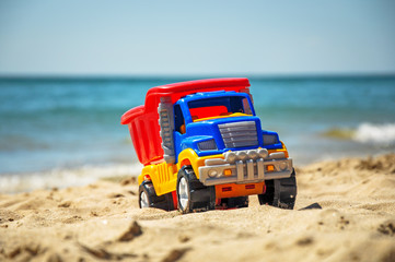 Toy in the sand beach.