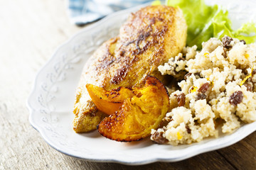 Fried chicken with oranges and couscous
