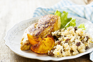 Fried chicken with oranges and couscous