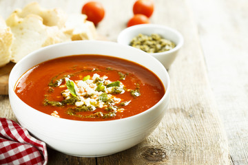Tomato soup with cheese and pesto sauce