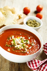 Tomato soup with cheese and pesto sauce