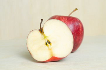 Apple isolated on wooden board background