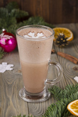 Hot chocolate on wooden background garnished with home made marshmallows. Snowflakes.