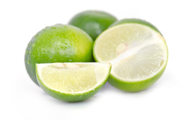 Lemon or lime fruit with half cross section and partial section