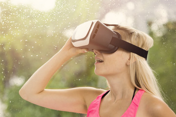 young woman feeling excited for using virtual reality headset