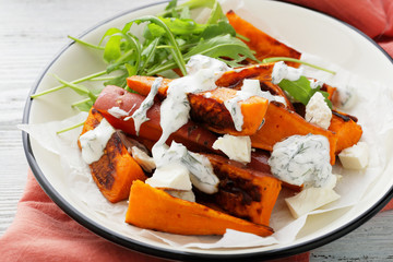 Baked sweet potatoes slice with sauce