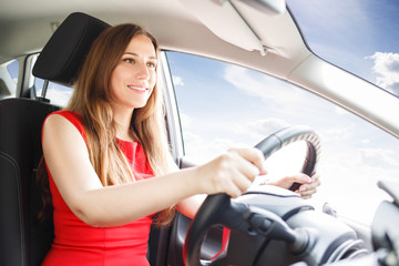 Naklejka premium Young woman driving car. Fast delivery background