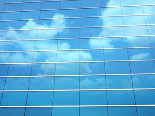 Clouds reflected in windows of modern building