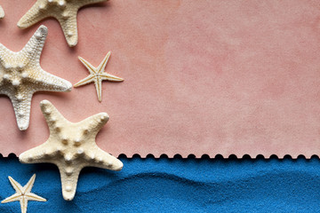 Paper sheet and starfish on blue background