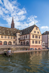 Fototapeta na wymiar Strasbourg, France. The Renaissance building of the old slaughterhouse (Grande boucherie), built in 1586-1588. Marina of tourist ships