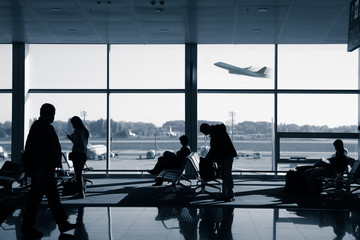 Real People waiting for the flight inside airport terminal