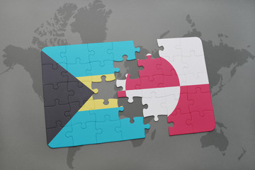 puzzle with the national flag of bahamas and greenland on a world map background.