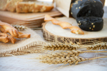 loaf of bread on wooden background, food closeup