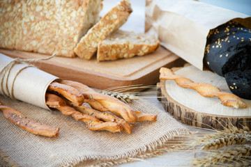 loaf of bread on wooden background, food closeup