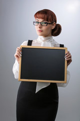 Woman with small blackboard