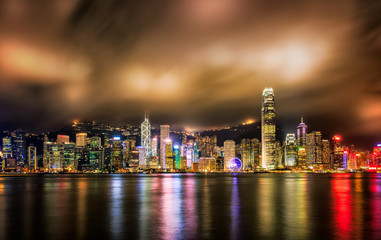 Hong Kong night view  with reflections of light on the cloud at victoria harbor