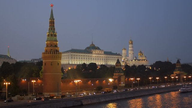 twilight view of embankment of Moscow river and Moscow Kremlin with ruby stars