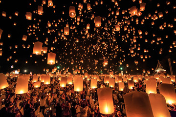 CHIANG MAI, THAILAND - NOVEMBER 8, 2014:  Visitors are launching colorful lanterns in Loykratong festival at Chiangmai, Thailand.