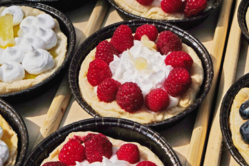 cakes with cream and raspberries