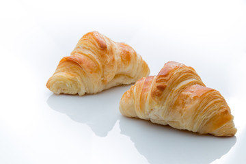 Two croissants on a white background