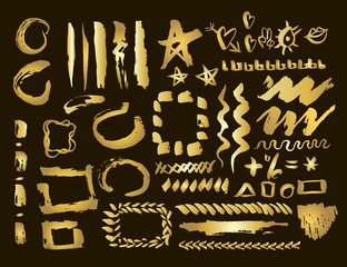 Gold design elements set. Brush strokes and borders.Golden stain set. Vector Illustration