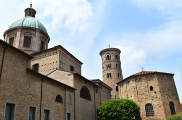 Fototapeta na wymiar The Baptistry of Neon, the Paleochristian bell tower and the neo-classic dome of the Metropolitan Cathedral of the Resurection of Our Lord Jesus Christ, Ravenna, Italy