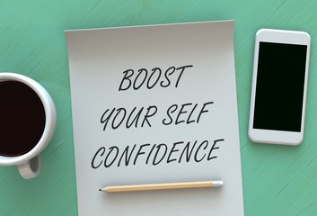 BOOST YOUR SELF CONFIDENCE, message on paper, smart phone and coffee on table, 3D rendering
