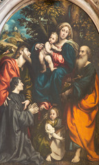 Obraz na płótnie Canvas CREMONA, ITALY - MAY 25, 2016: The painting of Madonna with the Child and St. Philip, Jacob, and donator Giacomo Schizzi in The Cathedral by Giovanni Antonio de Sacchis - Il Pordenone (1486 - 1539).