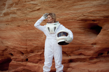 futuristic astronaut without a helmet on another planet, image with the effect of toning