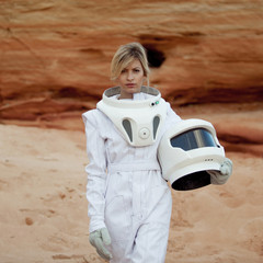 futuristic astronaut without a helmet on another planet, image with the effect of toning