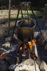 Casserole with rice and meat on a camp fire