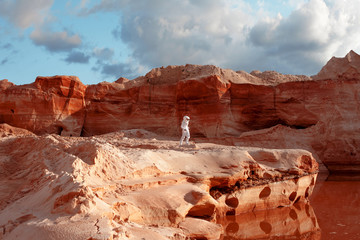 futuristic astronaut on another planet, image with the effect of toning