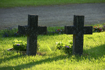two stone crosses in a military cemetery