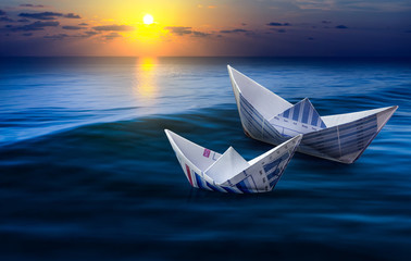 .Two paper boats on sea.business strong and competition concept.