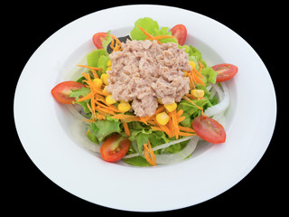 Tuna salad with lettuce and tomatoes isolated on the black background with clipping path