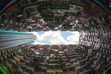 Hong Kong - May 31, 2015 : Back of crowded buildings stand surrounded the small common area,...