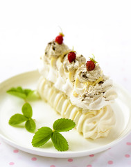 meringue cake with fresh berries on white background