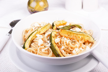 Spaghetti with zucchini and feta cheese