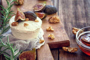 Ricotta with  ripe sliced fig fruits, nuts and honey