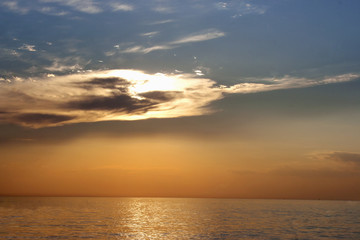 Naklejka na ściany i meble beautiful sunset with clouds over sea