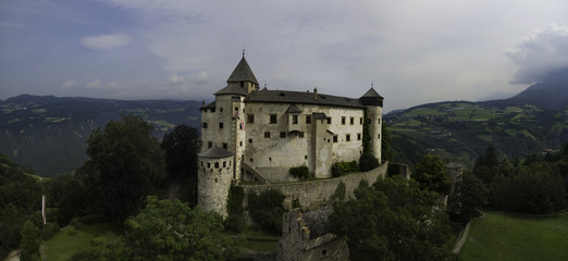 Fototapeta premium Castle Proesels in Italy. This is a 3 image aerial panoramic of the Castle, which is 20 minutes North of the city of Bolzano in the Italian Alps.