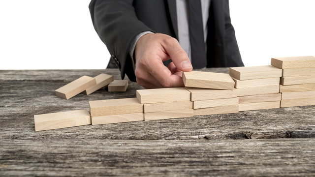 Hand Stacking Small Wooden Blocks