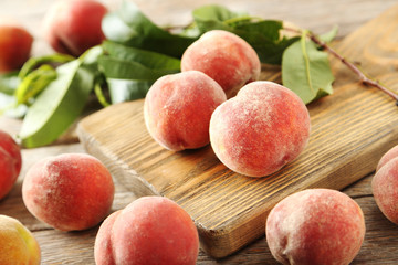 Sweet peach fruit on grey wooden table