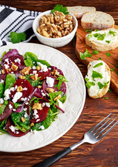 Healthy Beet Salad with fresh sweet baby spinach, kale lettuce, nuts, feta cheese and toast  melted 