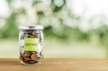 money in the glass. save money for investment concept.