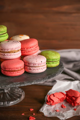 Tasty colorful macaroons on glass stand