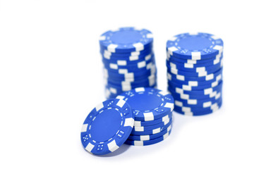 Blue poker chips isolated on white