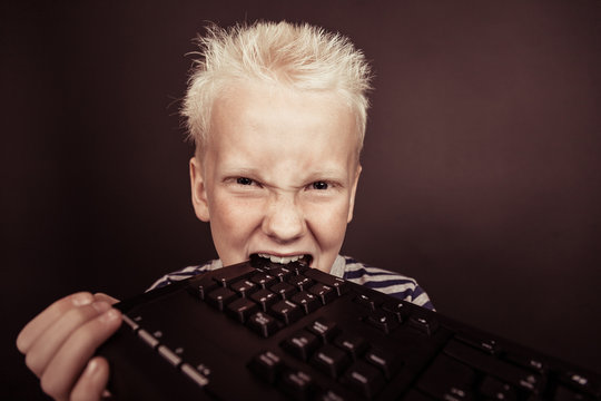 Boy with spiky blond hair wearing striped shirt - Powered by Adobe