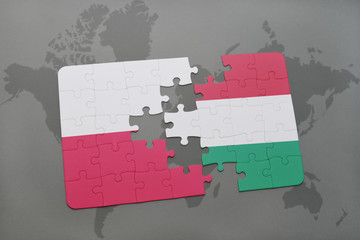 puzzle with the national flag of poland and hungary on a world map background.